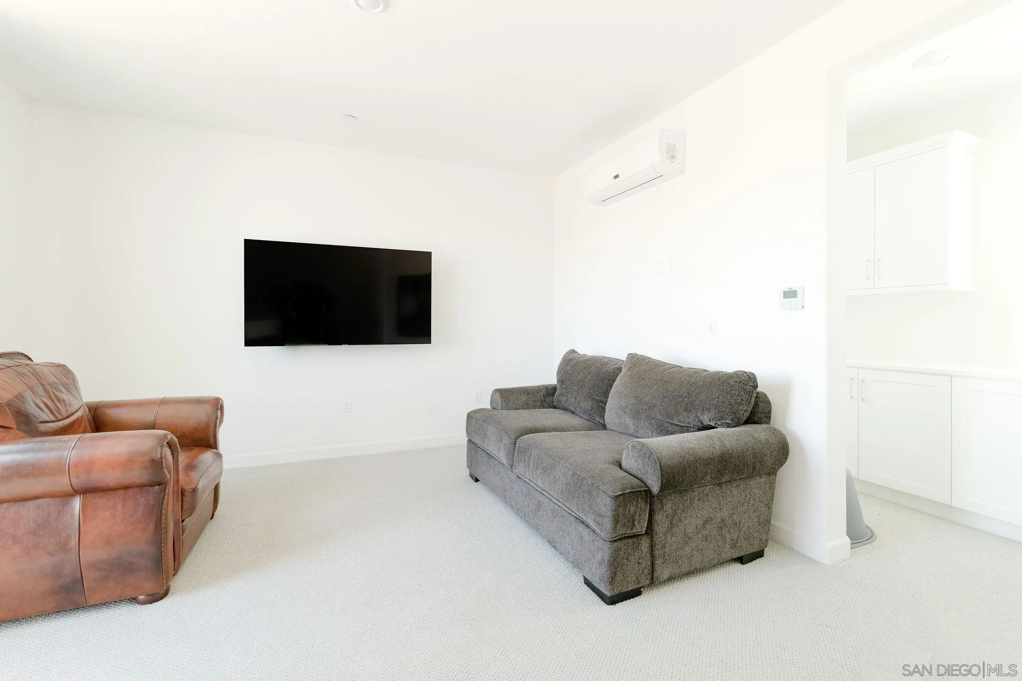 1983 Elevate Way Chula Vista, CA 91915 - Photo 29 of 39 a living room with furniture and a flat screen tv