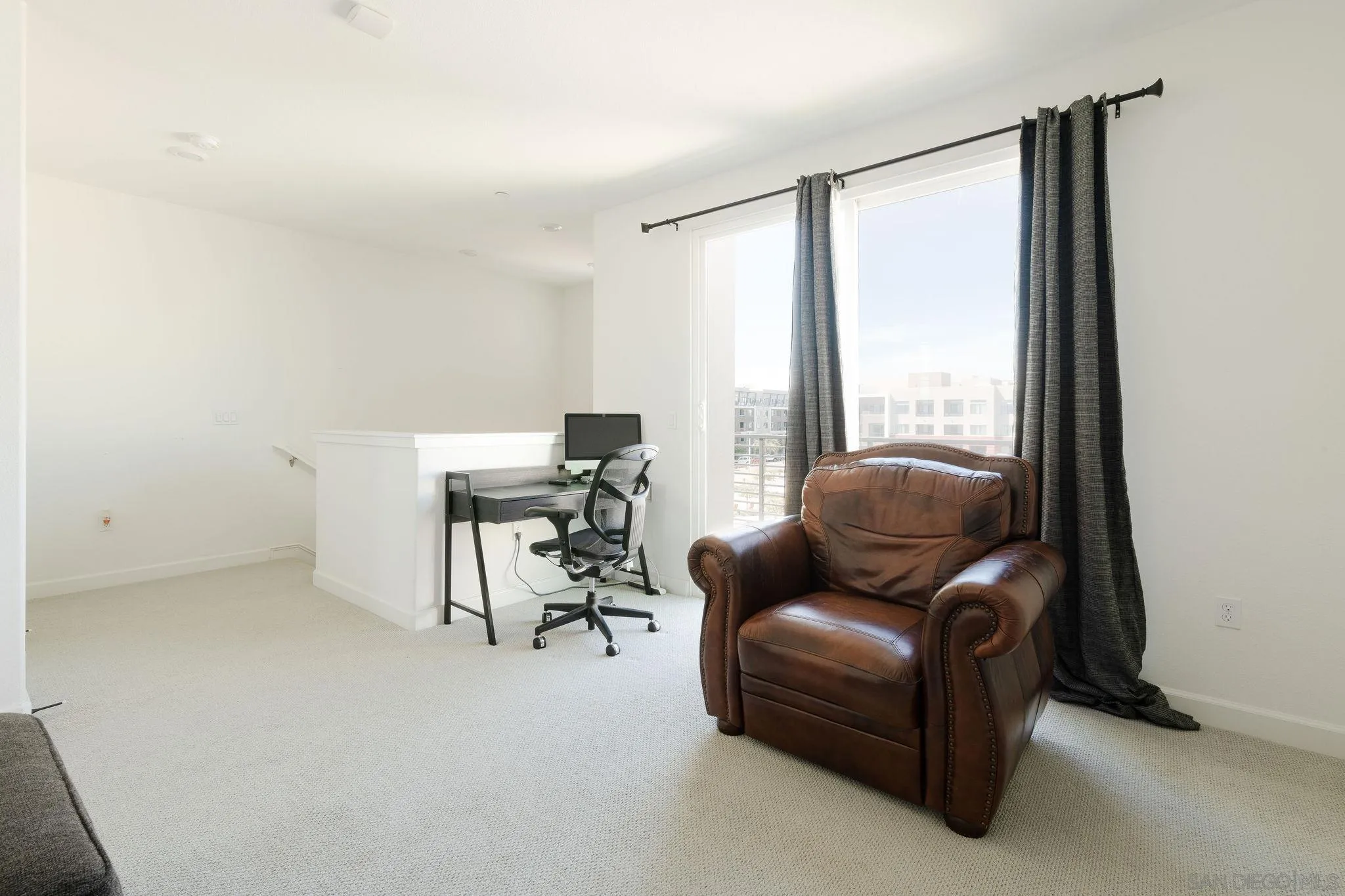 1983 Elevate Way Chula Vista, CA 91915 - Photo 31 of 39 a living room with furniture and a floor to ceiling window