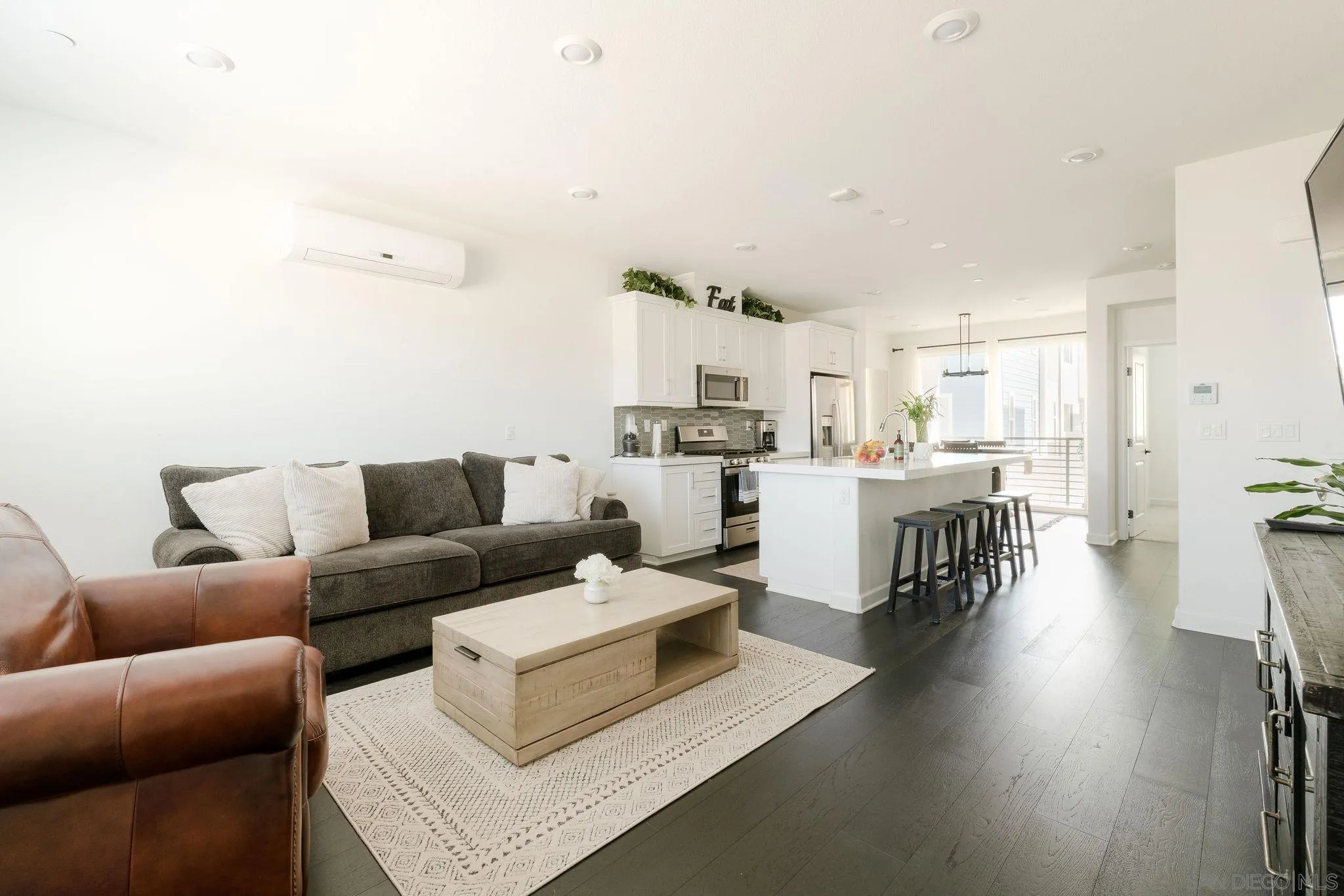 1983 Elevate Way Chula Vista, CA 91915 - Photo 4 of 39 a living room with furniture and kitchen view