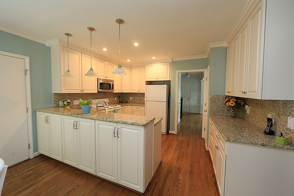 9712 Miranda Drive Raleigh, NC 27617 - Photo 9 of 25 There is a TON of space in these cabinets, which are engineered hardwood. The cabinets, lighting, and granite counter tops were all updated. Kitchen