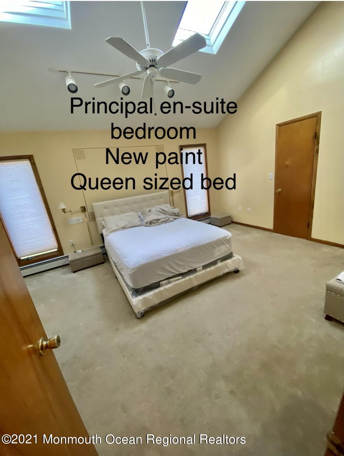 1706 Fanwood Street Oakhurst, NJ 07755 - Photo 14 of 26 a bedroom with a bed and a night stand