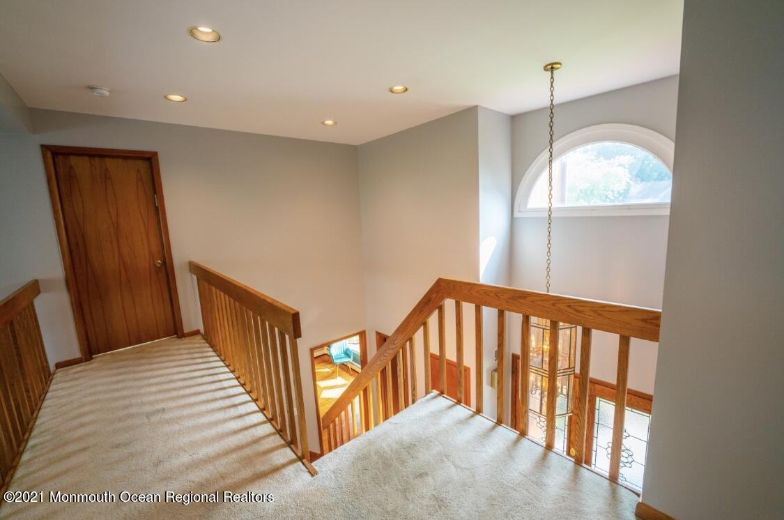1706 Fanwood Street Oakhurst, NJ 07755 - Photo 9 of 26 a view of a hallway with entryway wooden floor and front door