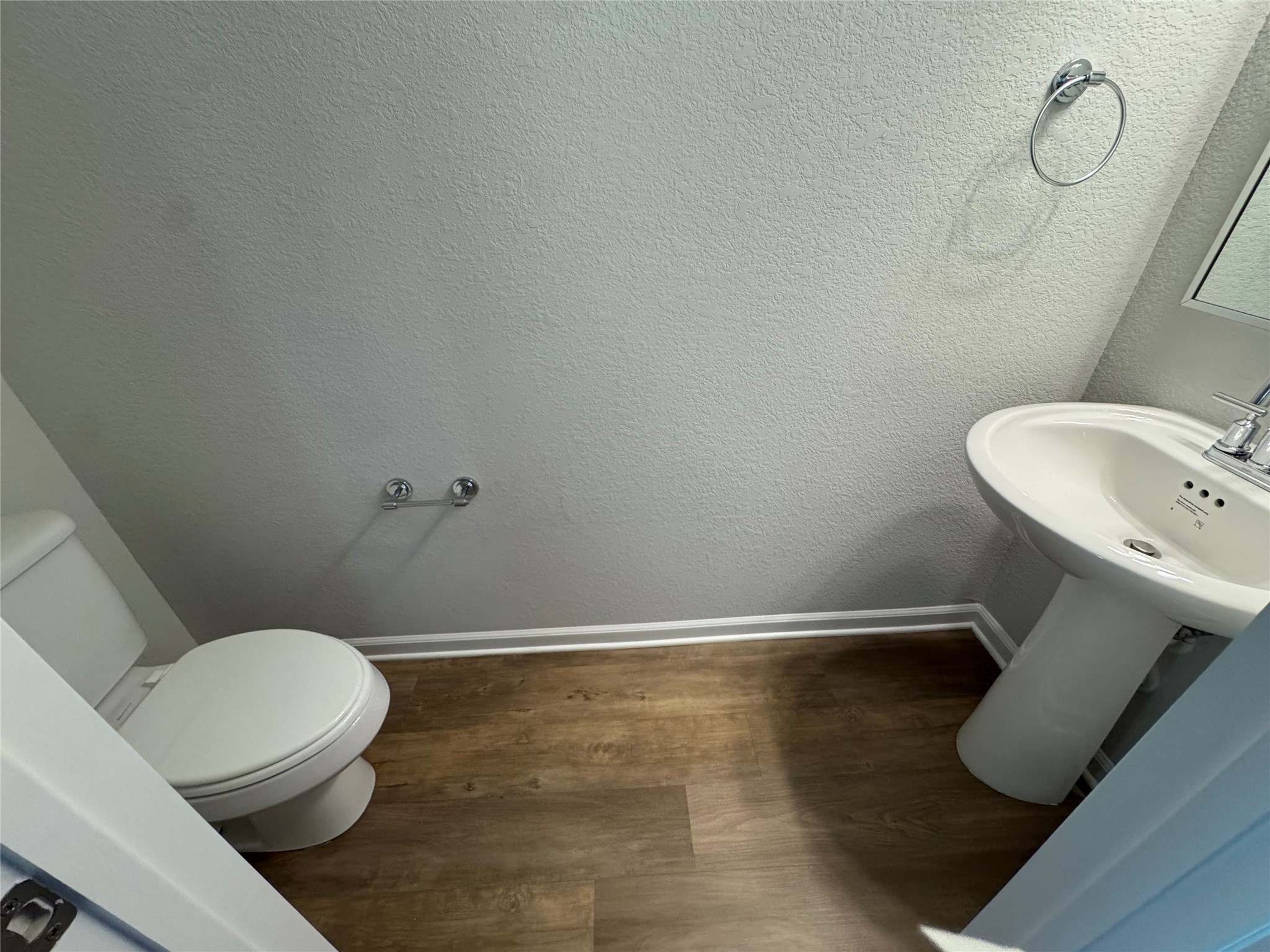 3000 Chisholm Trail Road, Unit 41 Round Rock, TX 78681 - Photo 26 of 28 A compact and functional powder room with durable flooring, ready for personalization.