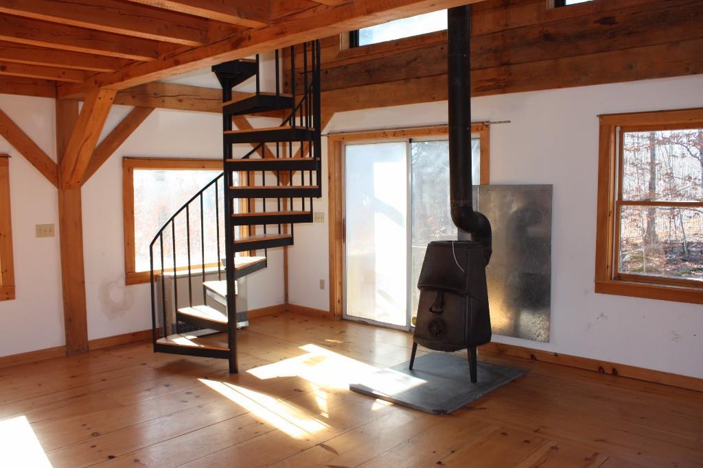 170 Patrick Mountain Road Washington, ME 04574 - Photo 11 of 18 Living room with heat stove