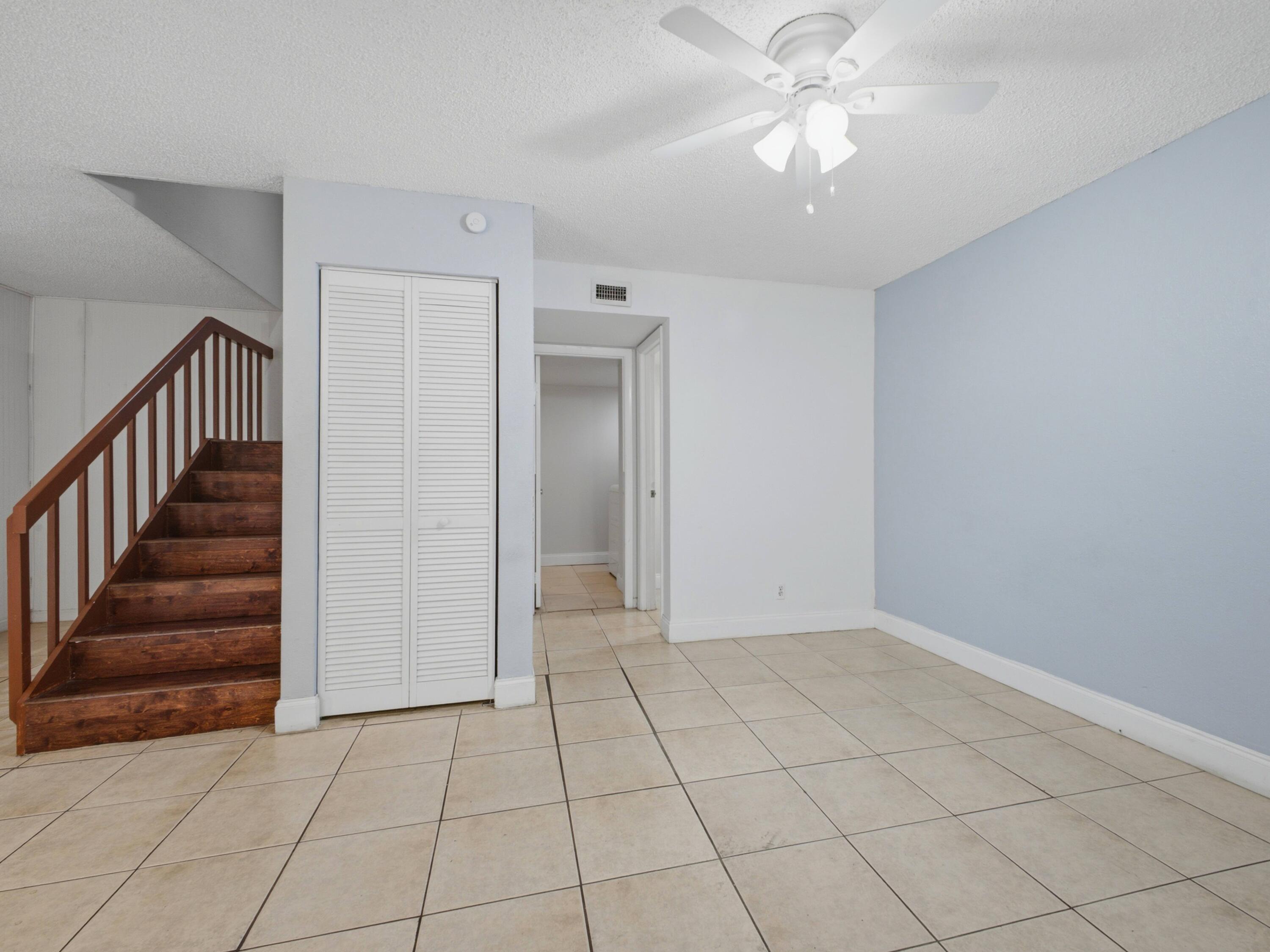 105 Woodland Road Palm Springs, FL 33461 - Photo 11 of 44 Living to Half Bath Laundry