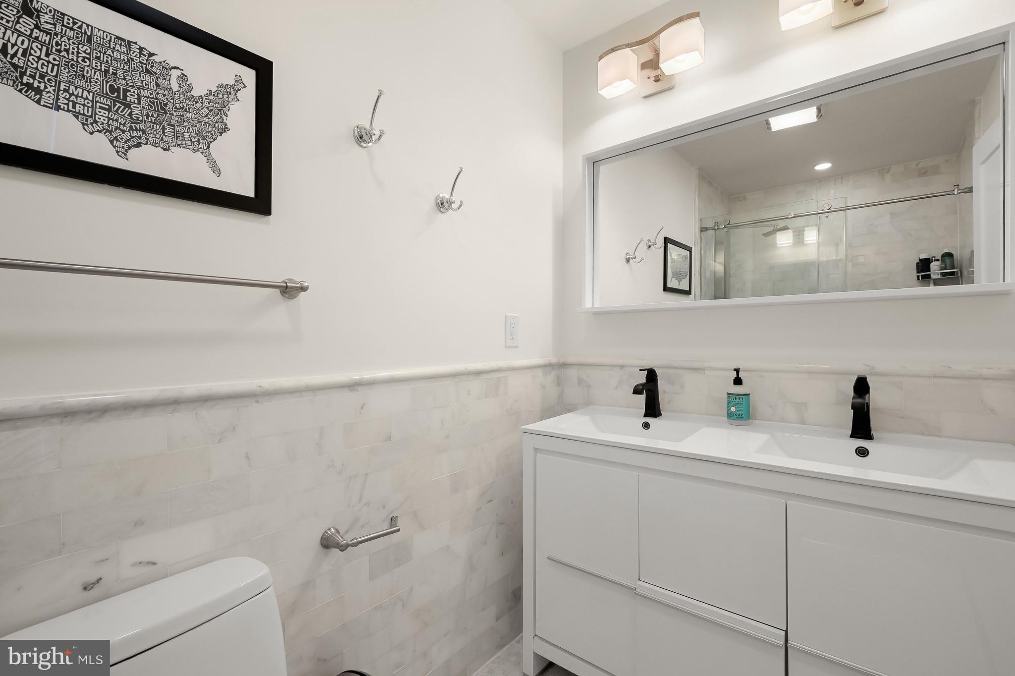 151 Uhland Terrace Northeast Washington, DC 20002 - Photo 13 of 21 Primary En-suite Bathroom with dual vanities