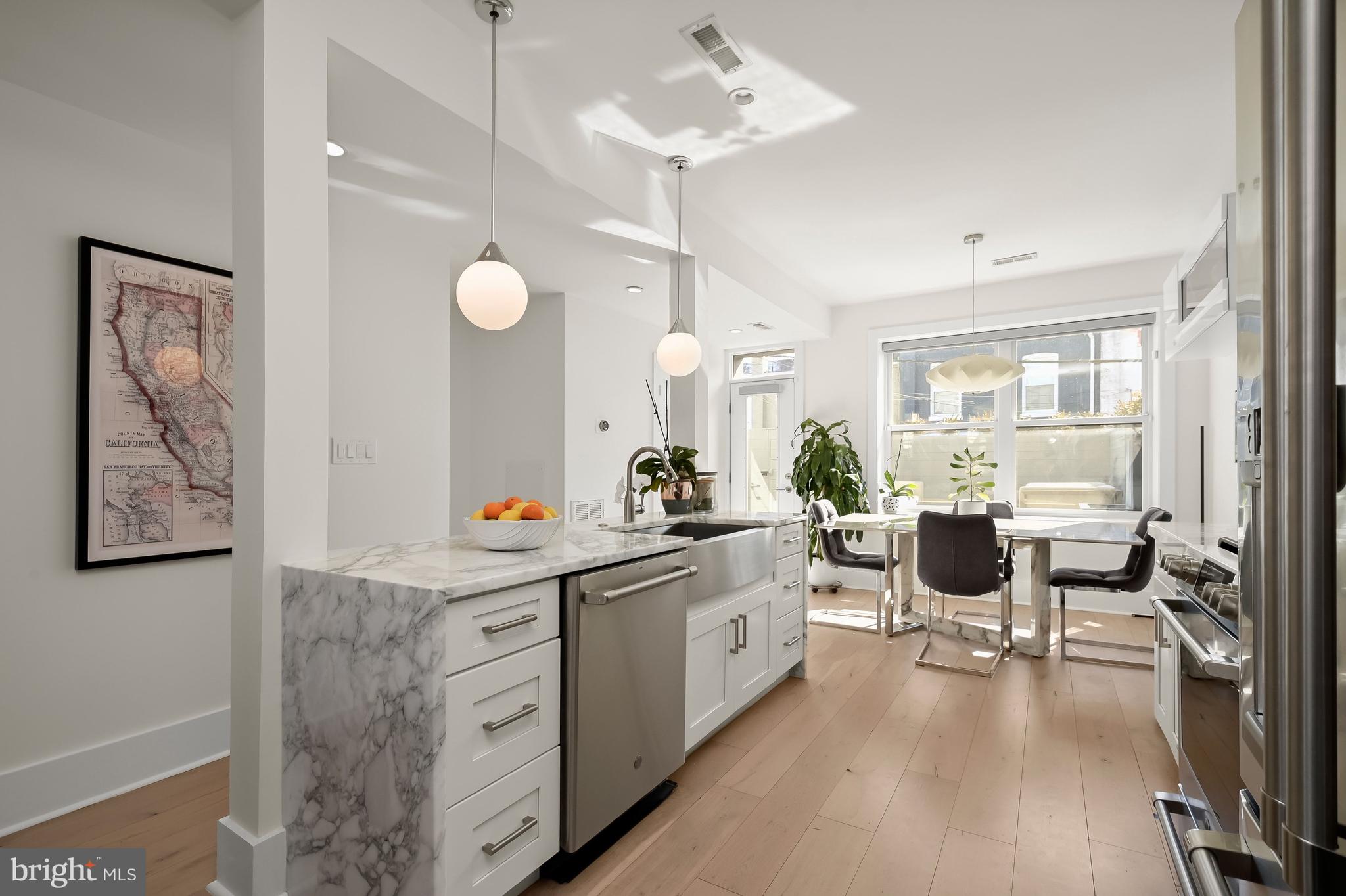151 Uhland Terrace Northeast Washington, DC 20002 - Photo 4 of 21 Open kitchen with expansive Carerra marble counter