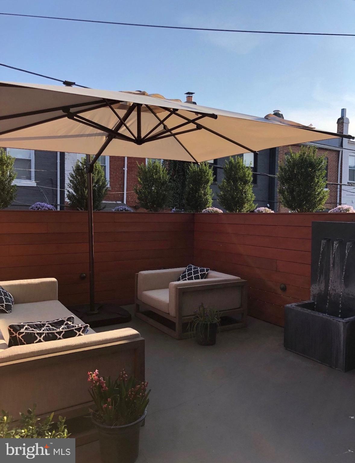 151 Uhland Terrace Northeast Washington, DC 20002 - Photo 7 of 21 Outdoor Patio above garage (fence painted)