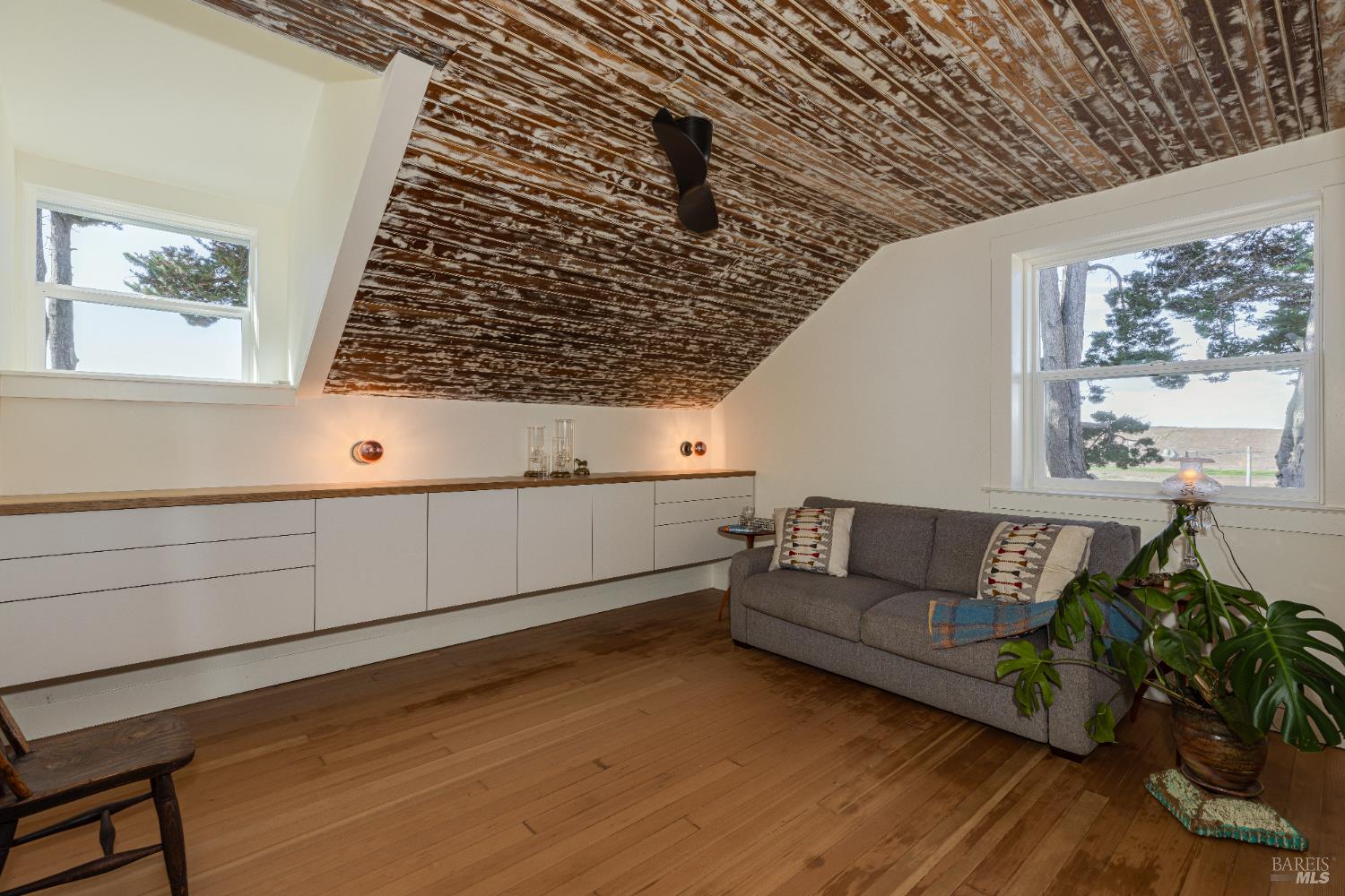 3150 Pepper Road Petaluma, CA 94952 - Photo 23 of 85 Guest Bedroom or an office showcasing the fabulous wood accent vaulted ceiling & Space Theory custom storage system.