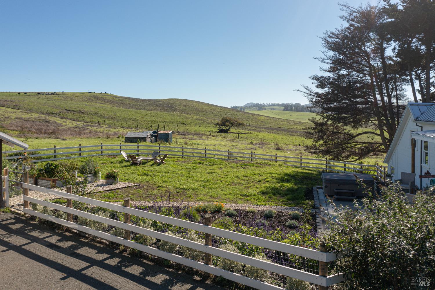 3150 Pepper Road Petaluma, CA 94952 - Photo 48 of 85 Spring colors are shining through! The front yard is fully enclosed for kiddos & four leggeds. A sweet garden area of raised containers to grow your own veggies & herbs!