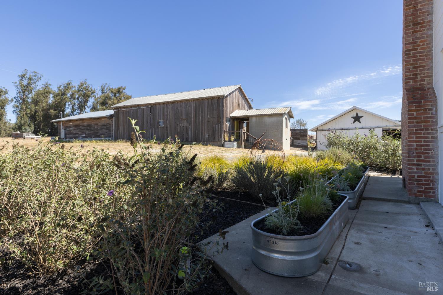 3150 Pepper Road Petaluma, CA 94952 - Photo 53 of 85 From this perspective, you can see the milking room, entertainment barn & attached large storage structure. The vintage barn is approximately 1600 square feet!