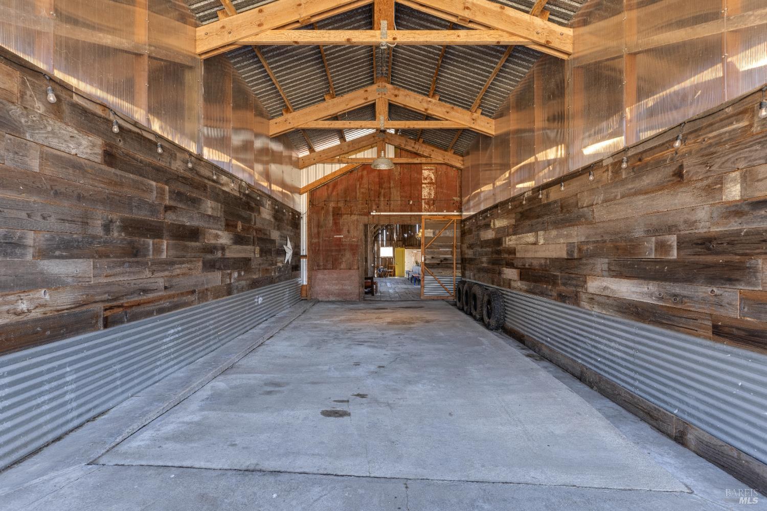 3150 Pepper Road Petaluma, CA 94952 - Photo 65 of 85 Another view into the barn from the bay. Note the animal proofing plastic barrier.
