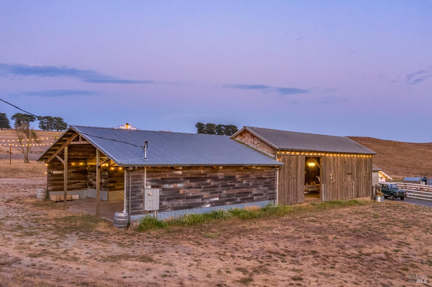 3150 Pepper Road Petaluma, CA 94952 - Photo 69 of 85 Barn & storage bay during twilight set off by exterior lighting.