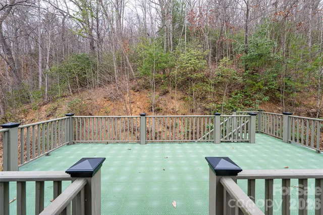 a view of balcony with a wooden fence