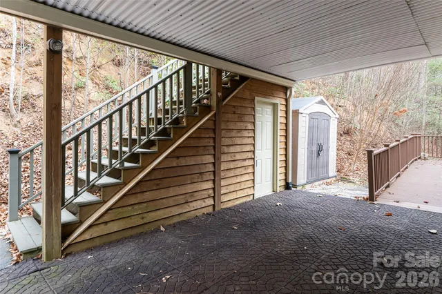 a view of balcony with wooden floor