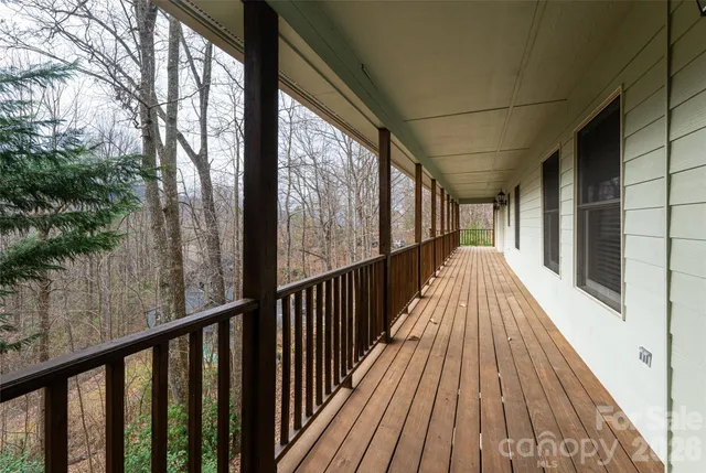 a view of balcony with wooden floor