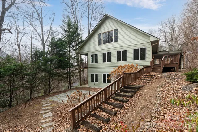 a view of a white house with a large windows