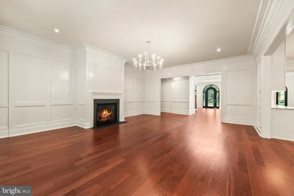 a spacious bathroom with a tub sink and mirror