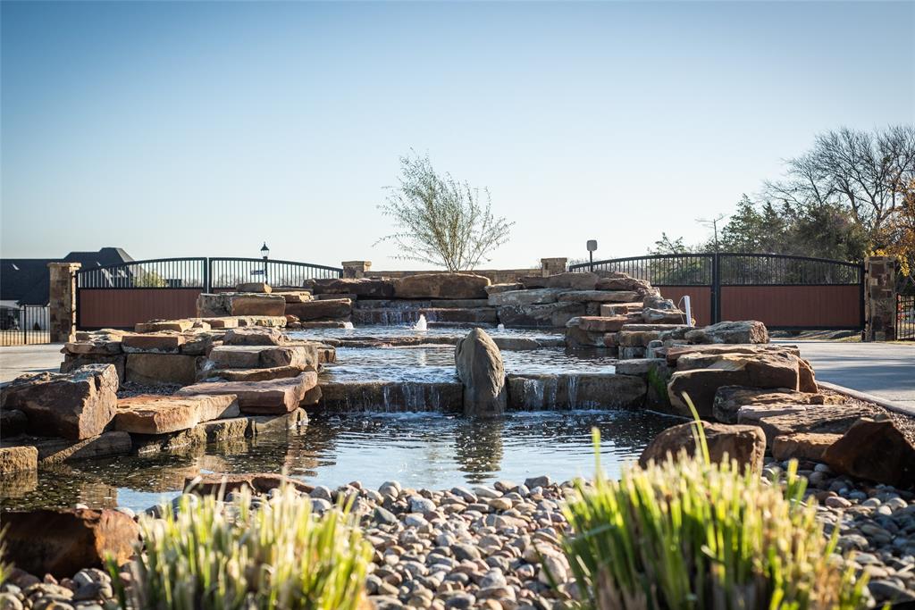 a view of a lake with couches and city view