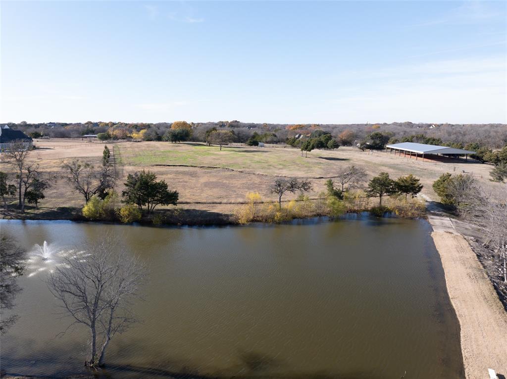 930 Cowboy Court Lucas, TX 75002 - Photo 17 of 31 a view of a lake with houses in the back