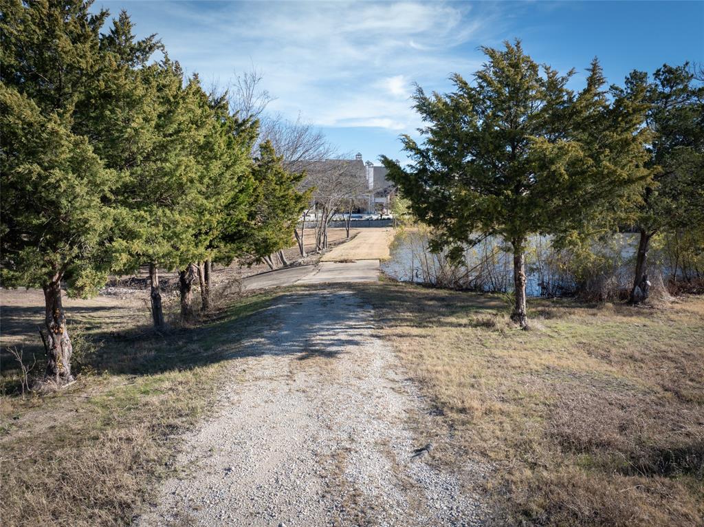 930 Cowboy Court Lucas, TX 75002 - Photo 20 of 31 a view of a yard with trees