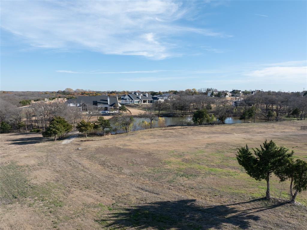 930 Cowboy Court Lucas, TX 75002 - Photo 21 of 31 a view of a lake with houses