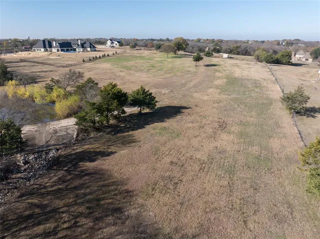 an aerial view of residential house and outdoor space