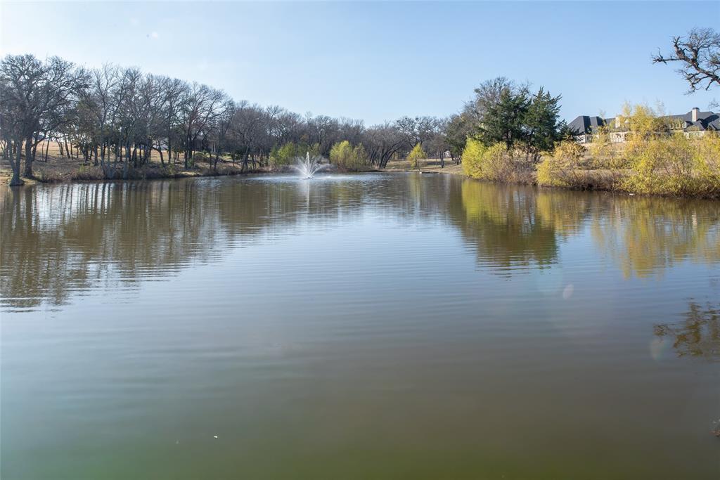 930 Cowboy Court Lucas, TX 75002 - Photo 7 of 31 a view of a lake with houses in the back