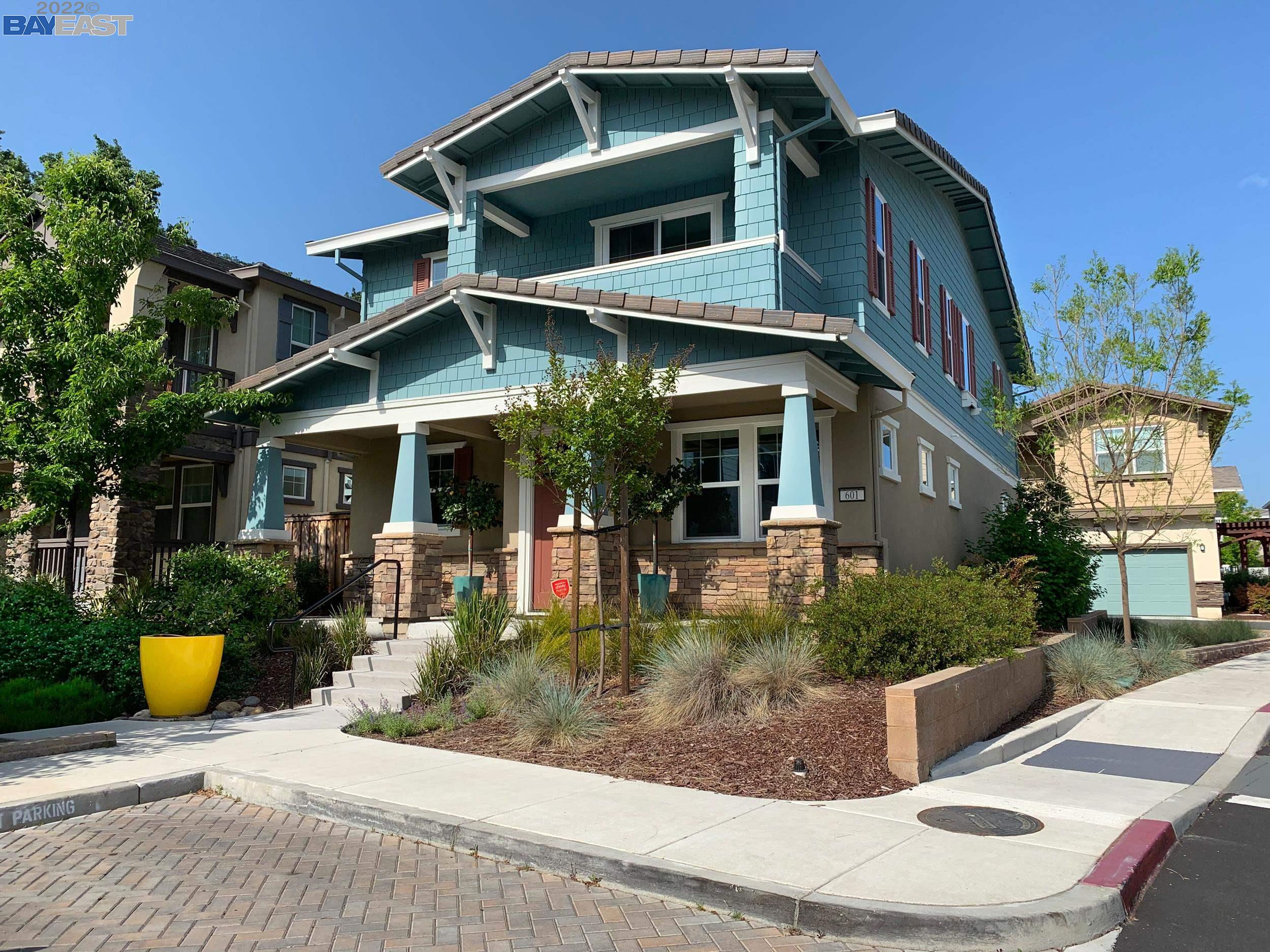 a front view of a house with sitting area