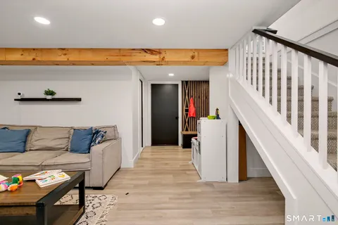 a view of an entryway with wooden floor
