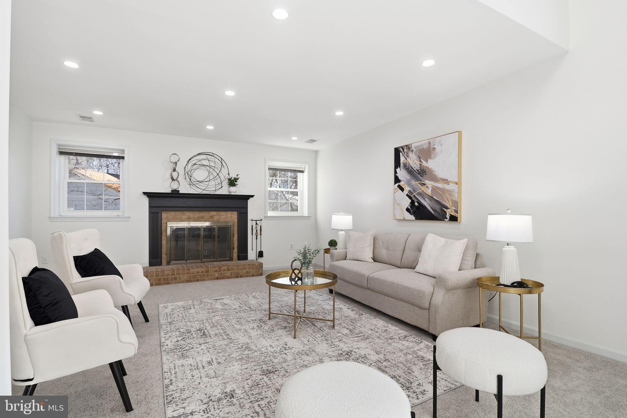 5207 Ruffner Woods Court Burke, VA 22015 - Photo 12 of 29 a living room with furniture and a fireplace
