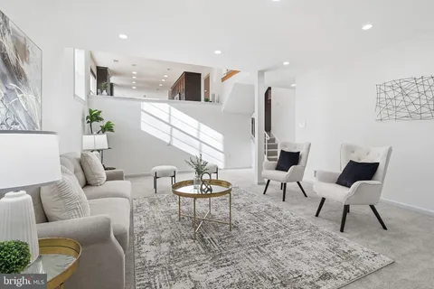 a living room with furniture and a table