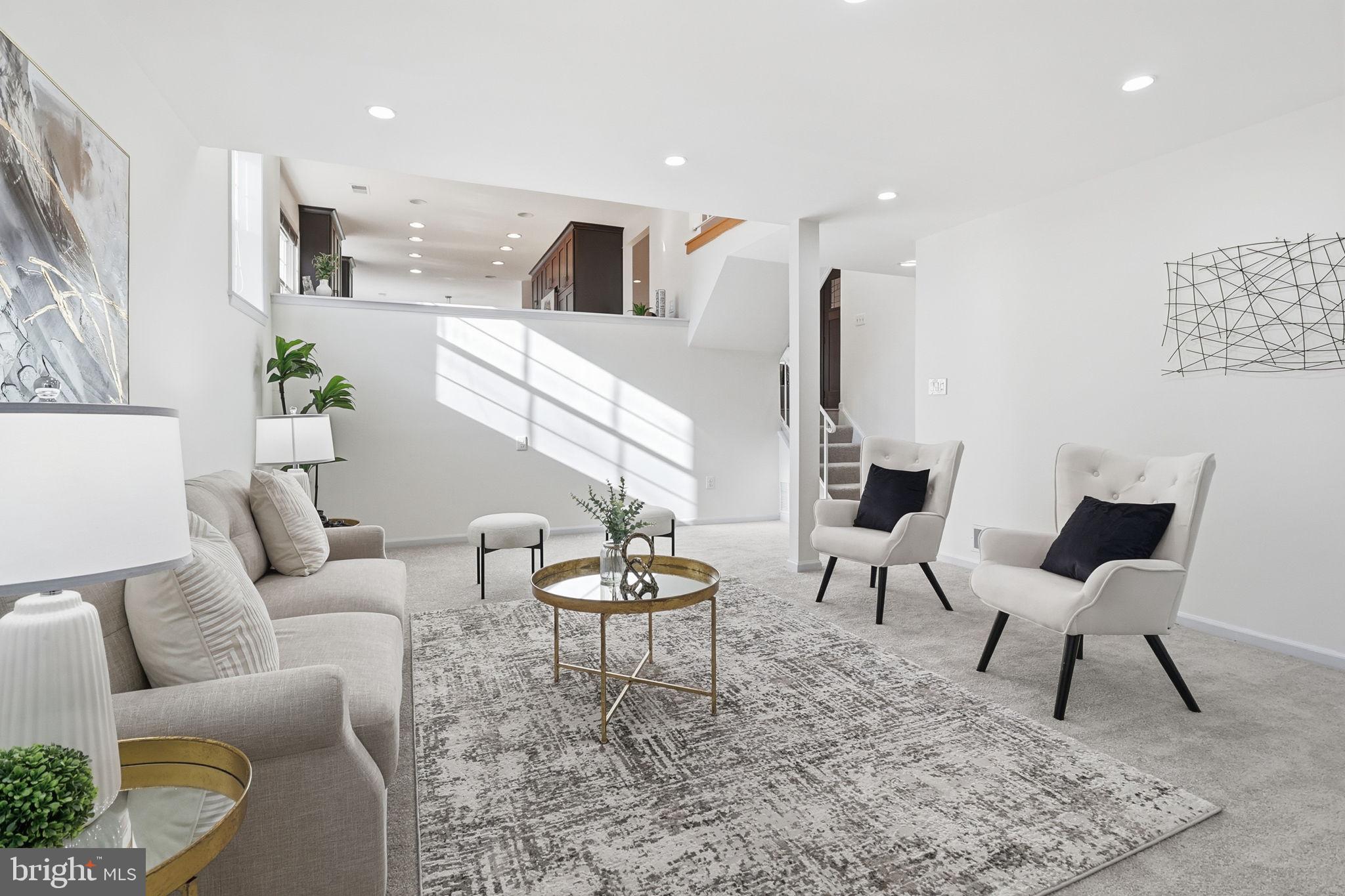 5207 Ruffner Woods Court Burke, VA 22015 - Photo 13 of 29 a living room with furniture and a table