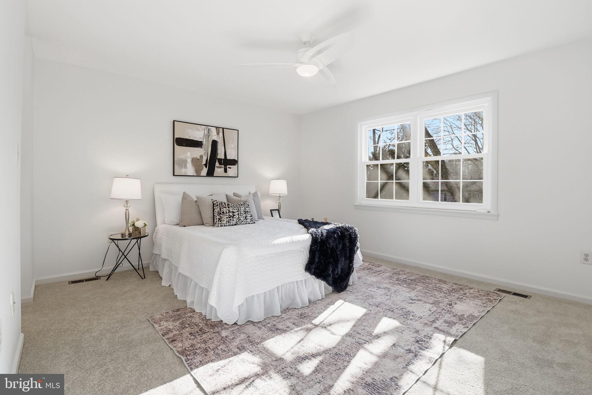5207 Ruffner Woods Court Burke, VA 22015 - Photo 17 of 29 a bedroom with a bed and a window