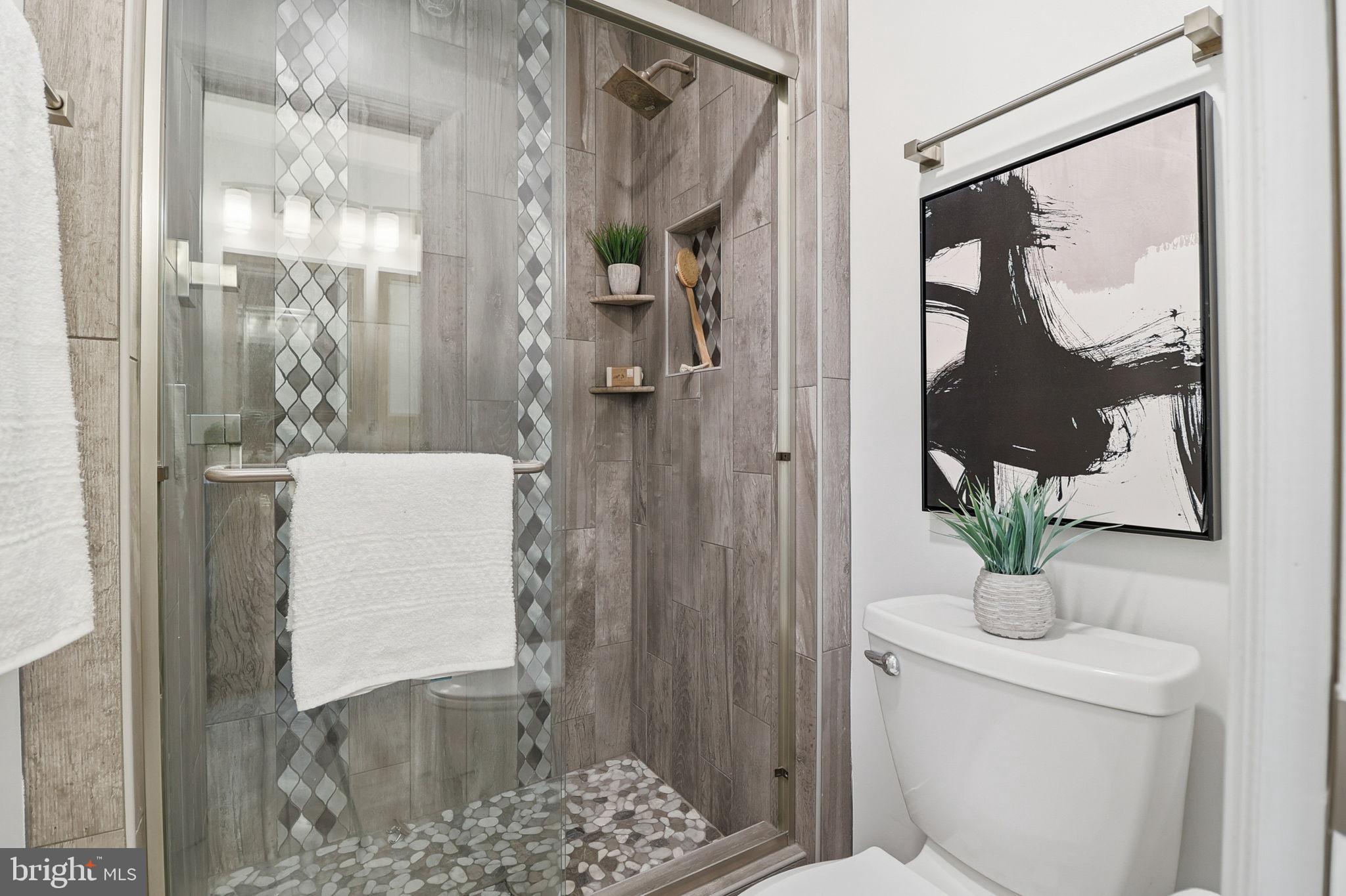 5207 Ruffner Woods Court Burke, VA 22015 - Photo 19 of 29 a bathroom with a sink and a mirror