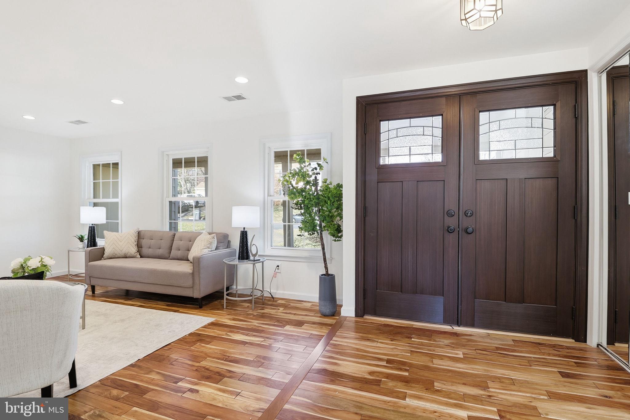 5207 Ruffner Woods Court Burke, VA 22015 - Photo 2 of 29 a bedroom with a bed and a couch