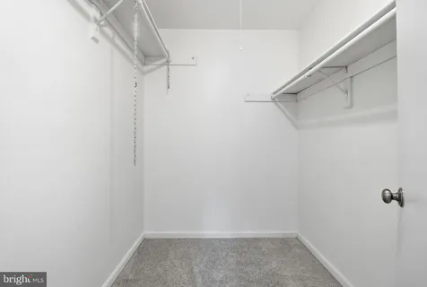 a view of a room with racks on the wall