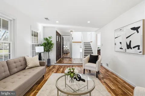 a living room with furniture and white walls