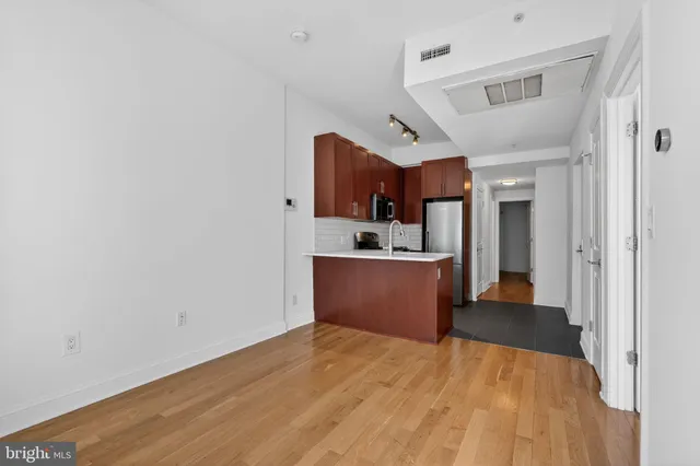 a view of kitchen and wooden floor