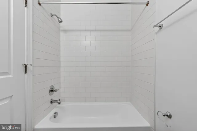 a close up of a bathtub curtain