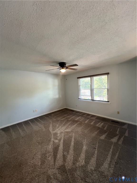 303 Bull Run Drive Hopewell, VA 23860 - Photo 3 of 16 an empty room with windows and ceiling fan view