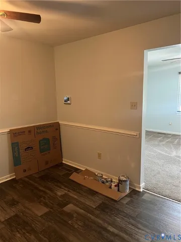 an empty room with wooden floor