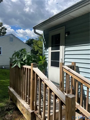 a view of a balcony with trees