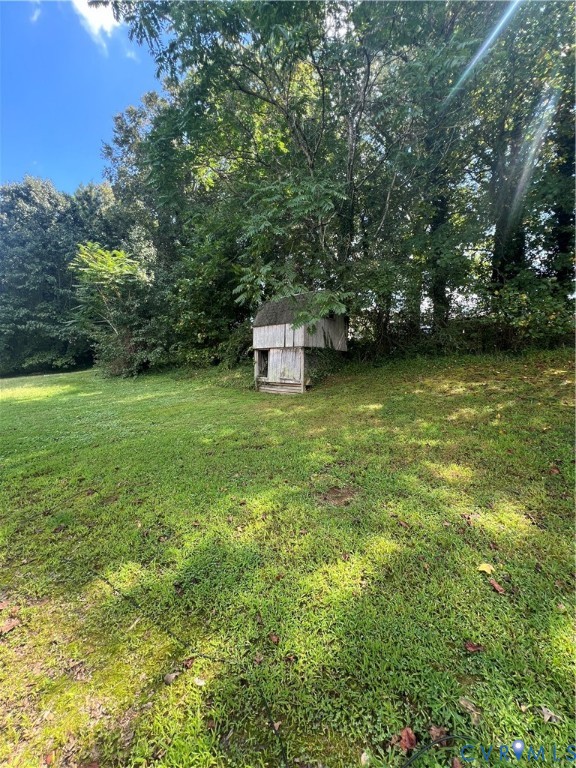 303 Bull Run Drive Hopewell, VA 23860 - Photo 7 of 16 a view of a large garden with plants and large trees