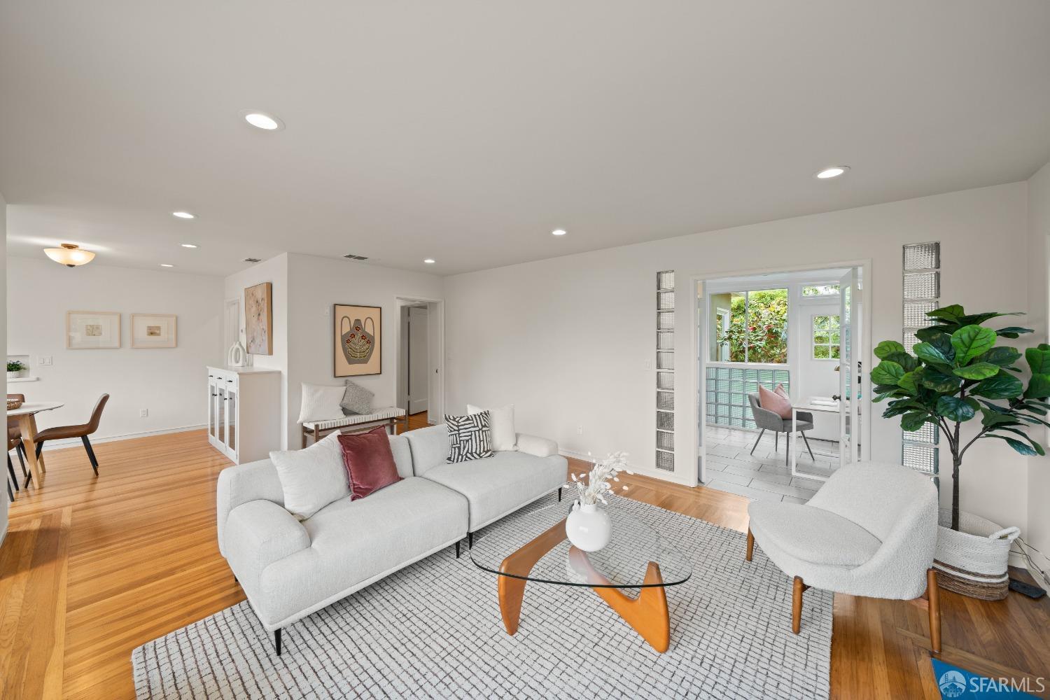 7746 Curry Avenue El Cerrito, CA 94530 - Photo 1 of 1 a living room with furniture and a potted plant