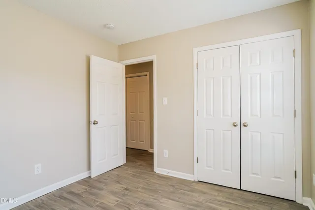 a view of a livingroom with wooden floor