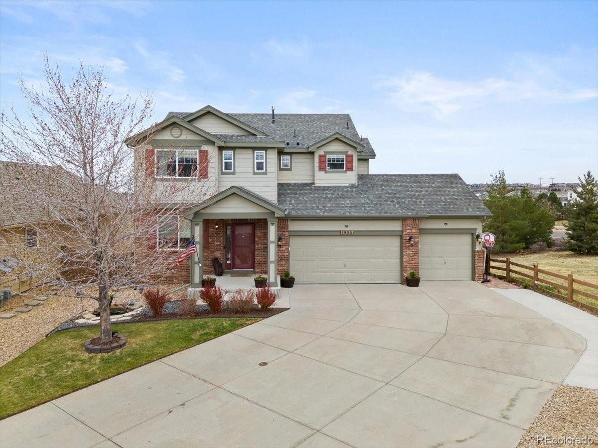 1906 Charbray Point Castle Rock, CO 80108 - Photo 2 of 44 a front view of a house with a yard and garage