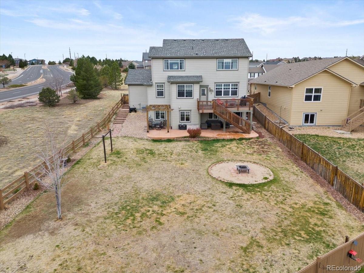1906 Charbray Point Castle Rock, CO 80108 - Photo 38 of 44 a view of a house with backyard and sitting area