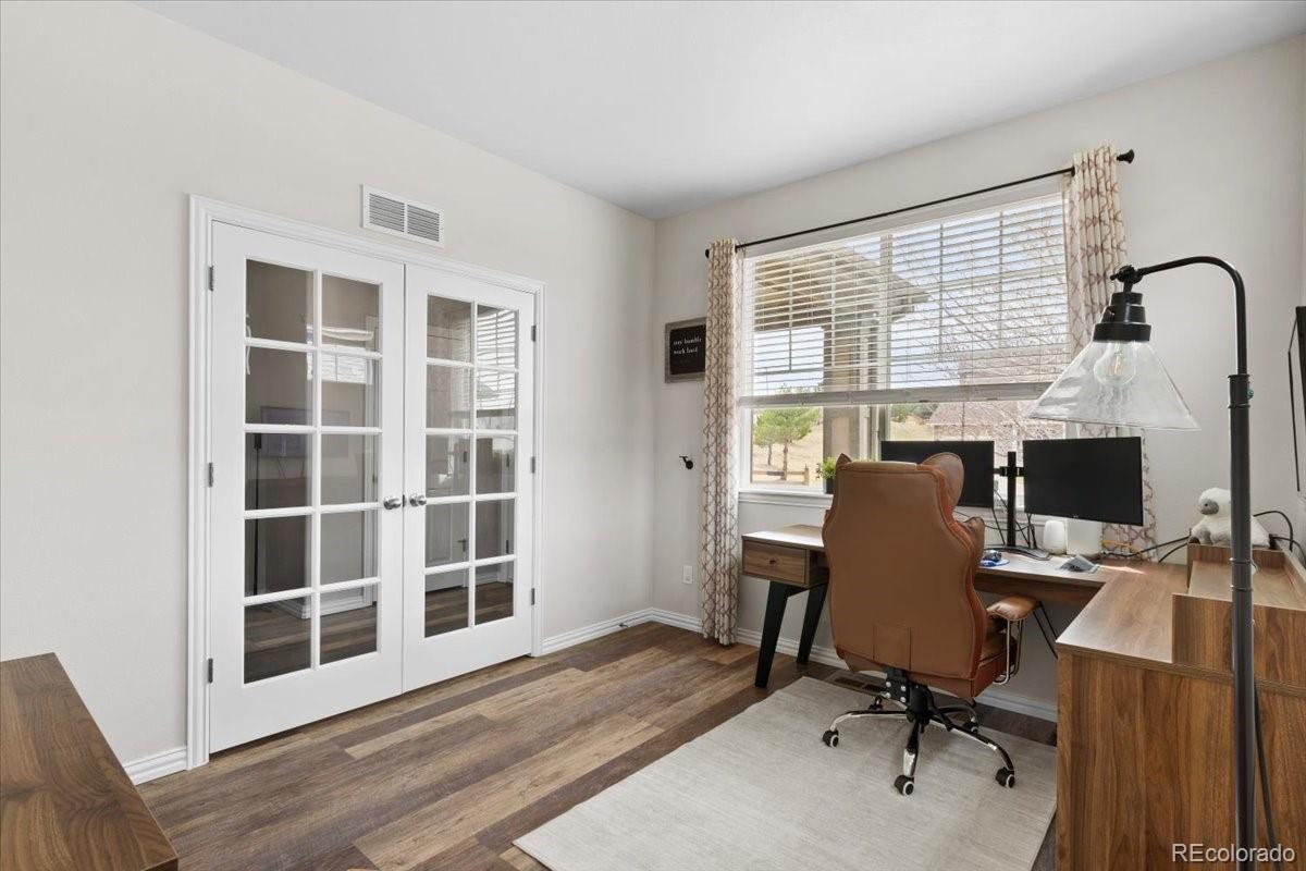 1906 Charbray Point Castle Rock, CO 80108 - Photo 5 of 44 a view of a workspace with furniture and a window