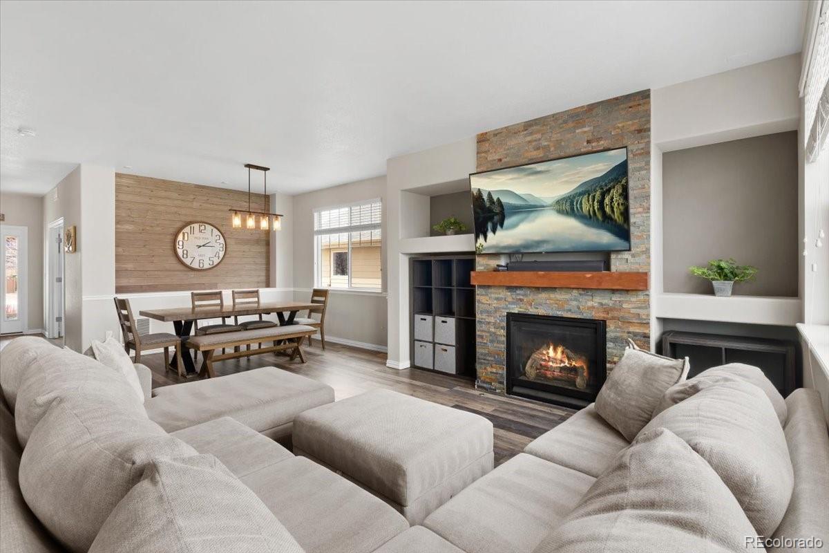 1906 Charbray Point Castle Rock, CO 80108 - Photo 10 of 44 a living room with furniture and a fireplace